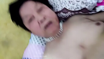 Middle-Aged Chinese Woman Engages In Sexual Activity